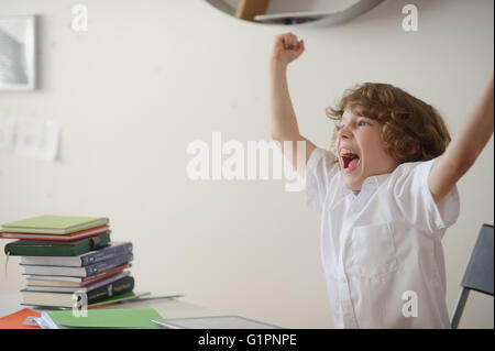 Schoolboy tired of doing lessons Stock Photo