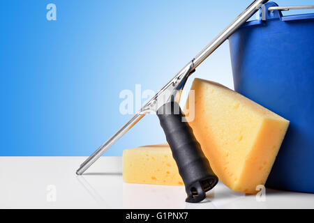 Window cleaning tools on white table. Front view. Horizontal composition Stock Photo