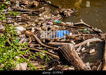 Litter washes up near the shoreline of of the North Canadian river in Oklahoma, USA. Stock Photo