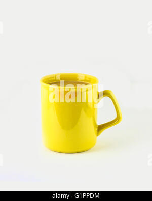 A yellow cup with a lipstick smear full of Starbucks Frappuccino cold drink. Stock Photo