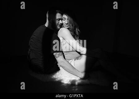 manly husband tenderly embracing his pregnant wife Stock Photo - Alamy