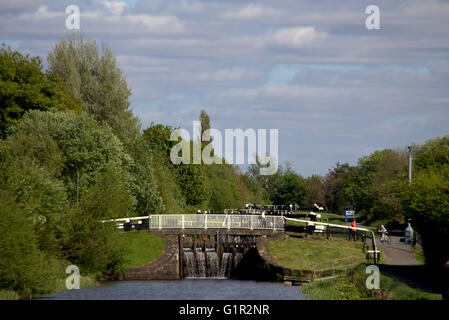 Children and adults on the locks of the Forth and Clyde canal near Clydebank, Glasgow, Scotland, UK. Stock Photo