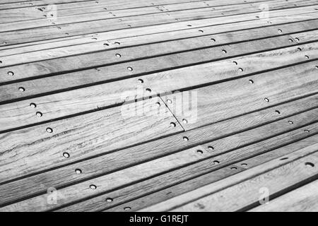 Abstract curved construction made of gray wooden planks, selective focus Stock Photo