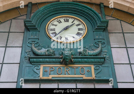 Clock in the railway station of Porto, Portugal Stock Photo