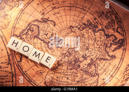 The text home on a brown world map Stock Photo