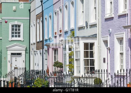 Row of colourful Georgian terraced houses on Bywater Street in Chelsea, London. Stock Photo