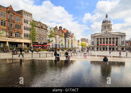 Various people sitting, walking, visiting in the main Market Square, Nottingham Stock Photo