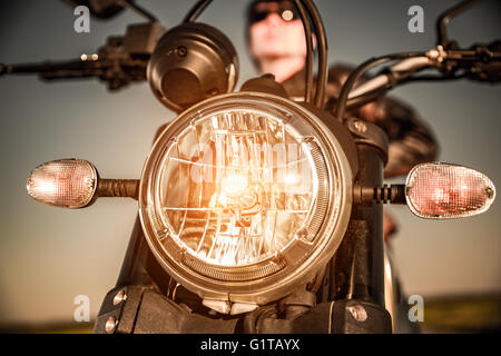 Motorcycle on the road motorcycle headlamp closeup Stock Photo - Alamy