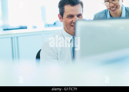 Business people working at computer in office Stock Photo