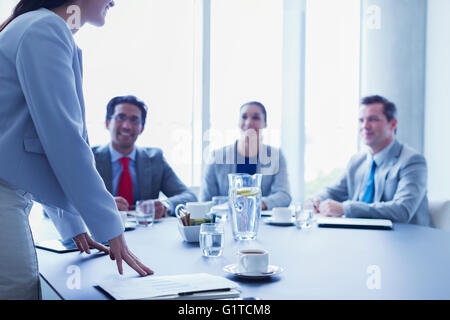 Businesswoman leading meeting in conference room Stock Photo