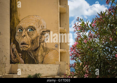 Marsaskala, Malta - 03 May 2016: Portrait of Gollum from Lord of the Rings fantastic story. Graffiti on a building under constru Stock Photo