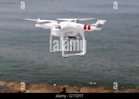 White drone quad copter with flying Stock Photo