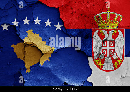 flags of Kosovo and Serbia painted on cracked wall Stock Photo