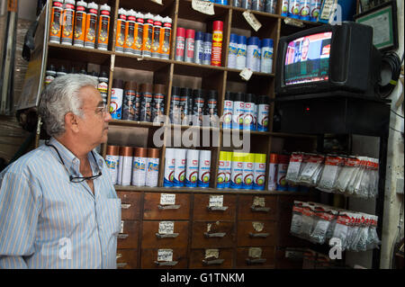 Cairo, Egypt. 19th May, 2016. An Egyptian man watches TV news about the missing EgyptAir flight MS804 carrying 66 people in Cairo, capital of Egypt, May 19, 2016. Credit:  Meng Tao/Xinhua/Alamy Live News Stock Photo