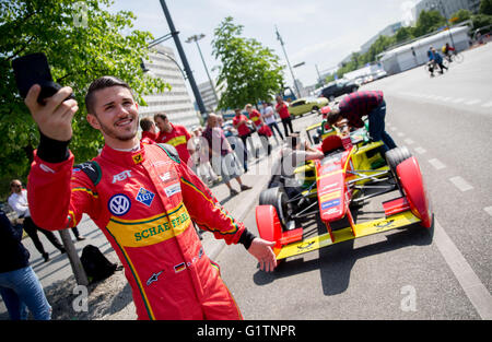 Berlin, Germany. 19th May, 2016. Formula E racing driver Daniel Abt stands next to his Formula E racing car of Abt Schaeffler in Berlin, Germany, 19 May 2016. The FIA Formula E Berlin ePrix race will take place on 21 May. Photo: KAY NIETFELD/dpa/Alamy Live News Stock Photo