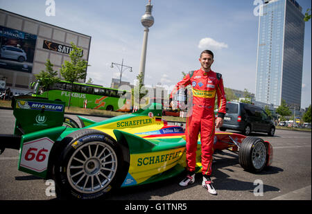 Berlin, Germany. 19th May, 2016. Formula E racing driver Daniel Abt stands next to his Formula E racing car of Abt Schaeffler in Berlin, Germany, 19 May 2016. The FIA Formula E Berlin ePrix race will take place on 21 May. Photo: KAY NIETFELD/dpa/Alamy Live News Stock Photo