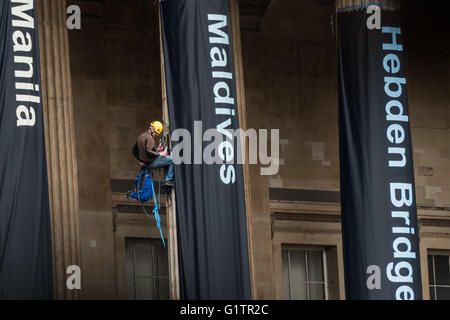 London, UK. 19th May, 2016. Greenpeace activists at the British Museum climbing on its columns where they have hung 7 giant banners on the opening day of the BP-sponsored 'Sunken Cities' exhibition, pointing out BP's responsibility for global warming, promoting the sale of oil leading to unstable weather and sea level rise which is now flooding cities and communities around the world. The banners named and showed images of flooding in the UK and worldwide and renamed the show 'Sinking Cities' to reflect BP's activities. Peter Marshall/Alamy Live News Stock Photo