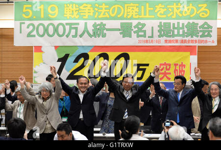 Tokyo, Japan. 19th May, 2016. The head of the main opposition Democratic Party Katsuya Okada (2nd R, Front), Kazuo Shii (3rd R, Front), chairman of the Japanese Communist Party, and Japan's Social Democratic Party leader Tadatomo Yoshida (4th R, Front), attend a rally in Tokyo, capital of Japan, on May 19, 2016. Japan's civic groups held a rally here on Thursday, submitting 12 million signatures demanding repeal of a controversial security law to the Diet through opposition parties. © Ma Ping/Xinhua/Alamy Live News Stock Photo