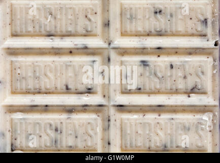 Bar of Hershey's Cookies 'n' Creme bar white chocolate flavoured candy with cookie pieces - close up Stock Photo