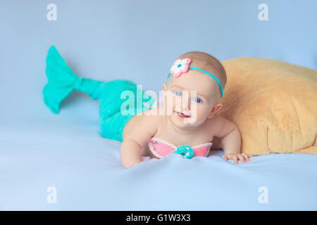 Baby girl dressed up in little mermaid costume Stock Photo