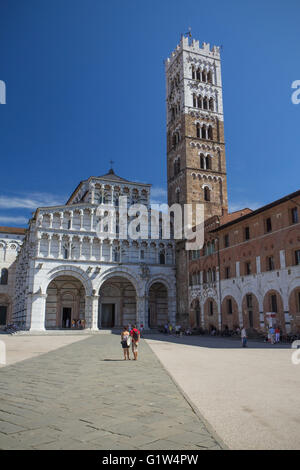 Next to the Duomo rises the crenellated bell-tower, which was finished in the 13th century (Lucca, Italy) Stock Photo