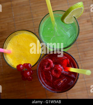 Glasses of juice, fruits  on a table Stock Photo