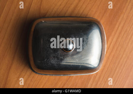 Butter dish close up. For butter. On a wood background. Stock Photo