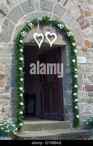 Door church and flowers Stock Photo