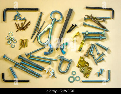 A collection of small items likely to be found in a tool box. Stock Photo