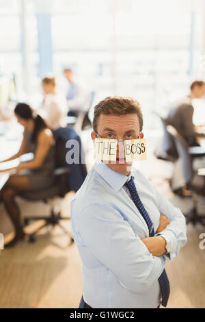 Portrait of confident businessman wearing “The Boss” eyeglasses in office Stock Photo