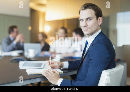Portrait confident businessman in conference room meeting Stock Photo
