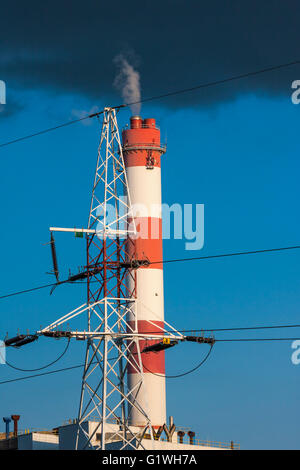 Environment pollution. Power plant. Chimney and high voltage lines. Stock Photo