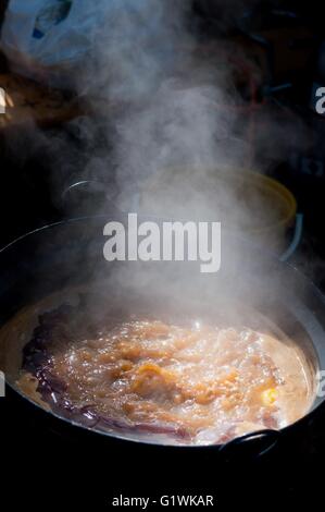 Traditional appetizing and tasty hungarian goulash soup in cauldron Stock Photo