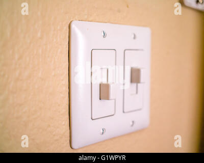 Two electrical switches on the wall with text On and Off on them Stock ...
