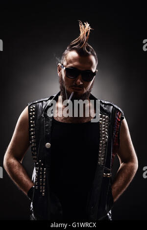 Punk rocker smoking cigarette Stock Photo - Alamy