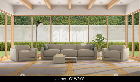 Modern Living room of a holiday villa with large window and garden- 3d rendering - the image on background is a my render compos Stock Photo