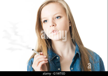 Teenage girl with cigarette isolated on white Stock Photo