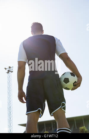 Low angle view of a soccer player with a ball Stock Photo