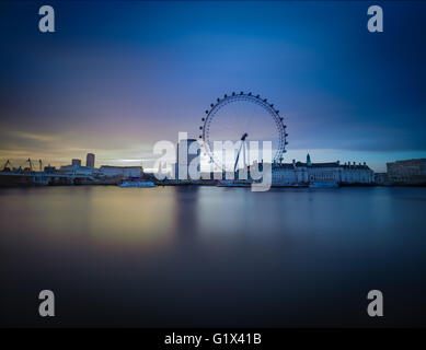 Golden hour long exposure of the London Eye at dawn. Stock Photo