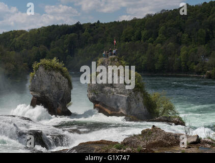 Visitors on rocks, Rheinfall, Rhine Falls near Schaffhausen, Canton of Schaffhausen, Switzerland Stock Photo