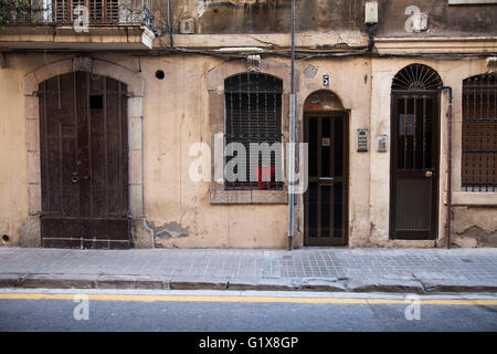 Antique door and old wall in the street, Barcelona Stock Photo