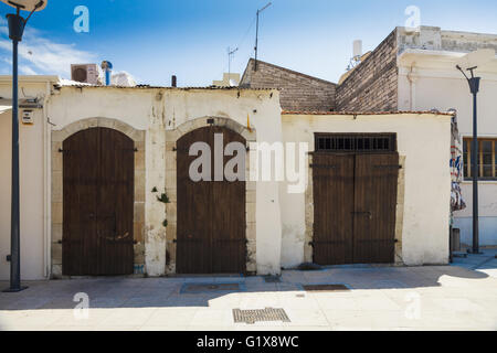 Wooden doors in old brick house in the city of Limassol, Cyprus Stock Photo