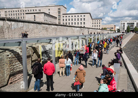 View of tourists visiting outdoor museum at Topography of Terror former Gestapo headquarters in Berlin Germany Stock Photo