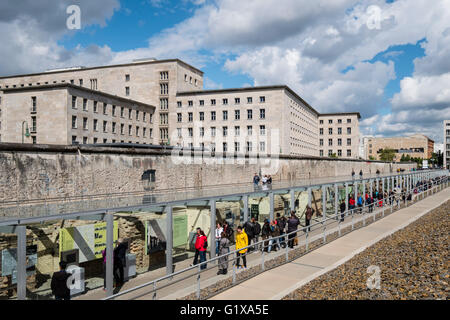 View of tourists visiting outdoor museum at Topography of Terror former Gestapo headquarters in Berlin Germany Stock Photo