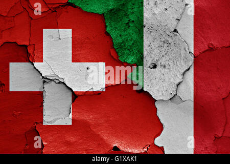 flags of Switzerland and Italiy painted on cracked wall Stock Photo