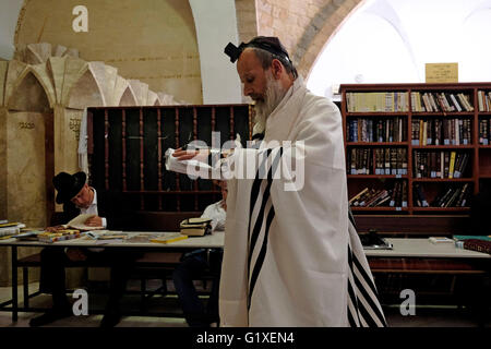 Ultra orthodox Jews praying inside the tomb of Rabbi Meir Baal Hanes who lived around 217 CE and is considered  a major Jewish pilgrimage site in Israel located in the city of Tiberias Israel Stock Photo