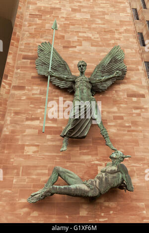 Statue of St Michael & the Devil by Jacob Epstein, New Coventry Cathedral, Coventry Warwickshire UK Stock Photo