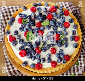 Tart with raspberries and blueberries. Top view Stock Photo