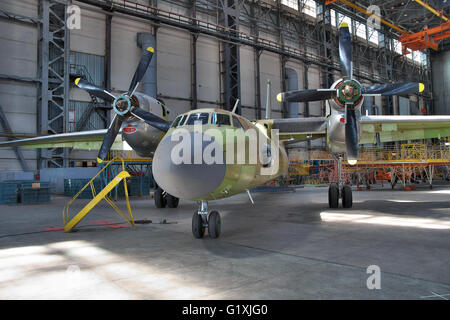 Kiev, Ukraine - August 3, 2011: Antonov An-32 cargo plane being assembled at the aircraft manufacturing hangar Stock Photo