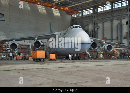 Kiev, Ukraine - August 3, 2011: Antonov An-124 Ruslan cargo plane being checked and maintenanced in hangar Stock Photo